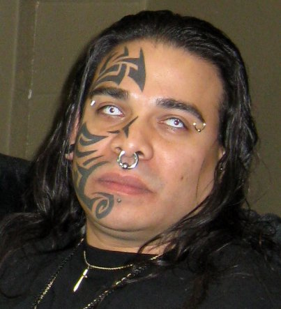 Tribal half face tattoo.