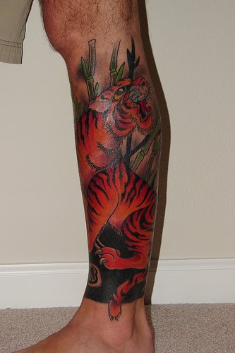 Tiger leg tattoo.