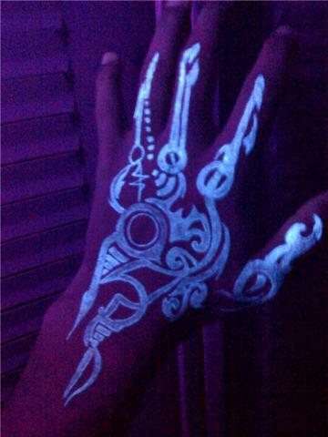 The UV reactive ink tattoos need a black light in order to glow here is a
