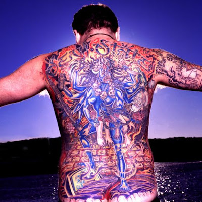 Buddhist tattoo are often seen alongside flower designs, specially the lotus Buddhist Tattoo Designs