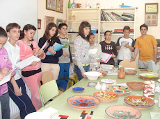 Gregoria, the ceramic teacher explaining the job some immigrant boys are learning at our school.