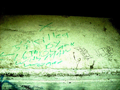 Green writing 5 foot 9 inches by 6 feet 5 inches Black Man with Woman.