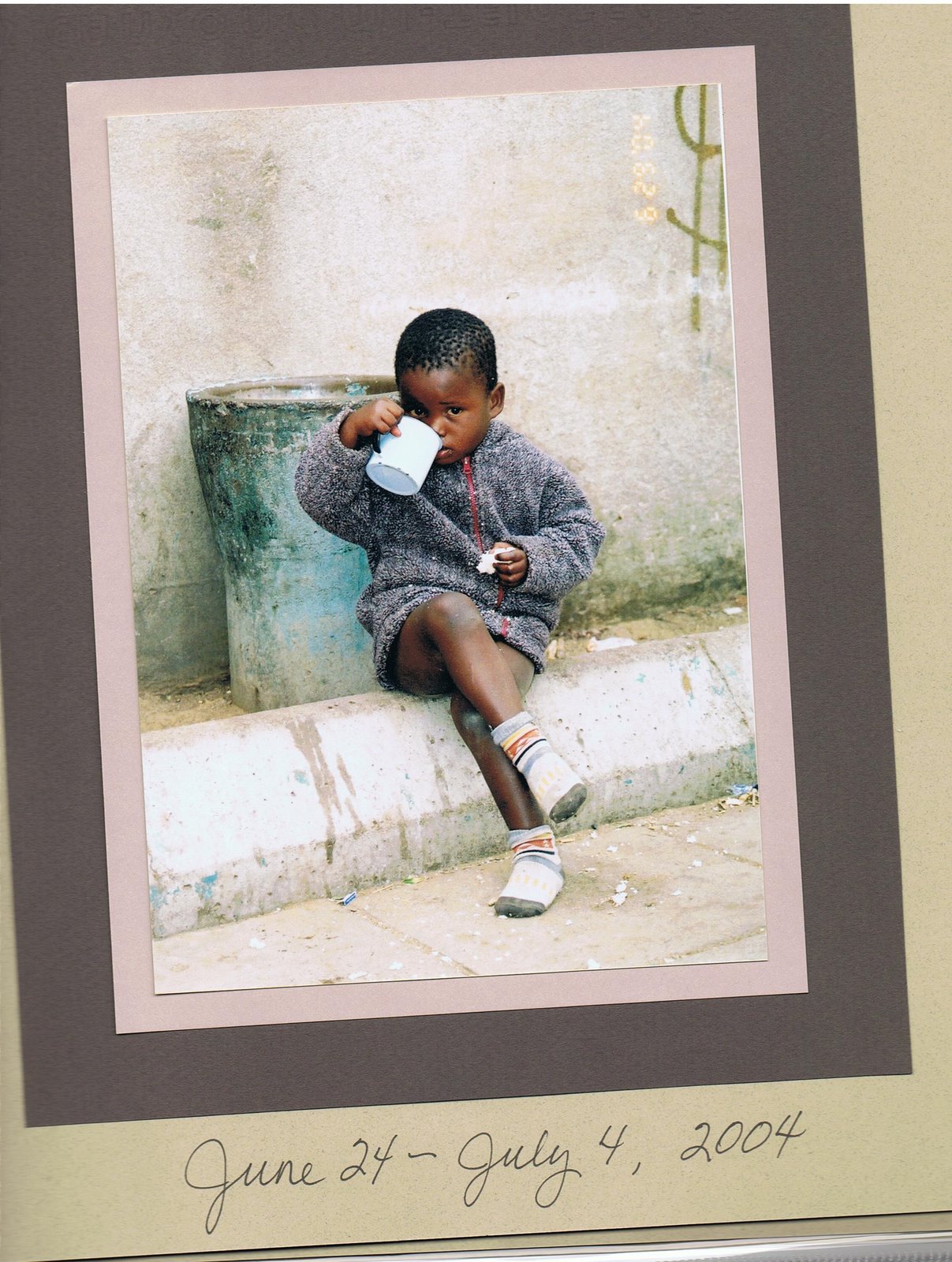 [African+Boy+with+Tin+Cup.jpg]