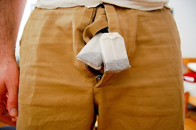 guy with teabags in front of his balls