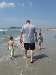 On the beach with a shirt on because I am FAT