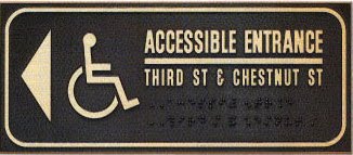 the signage should be placed in a location that does not required person to retrace the approach route from inaccessible entrance restroom directional sign e32 restroom