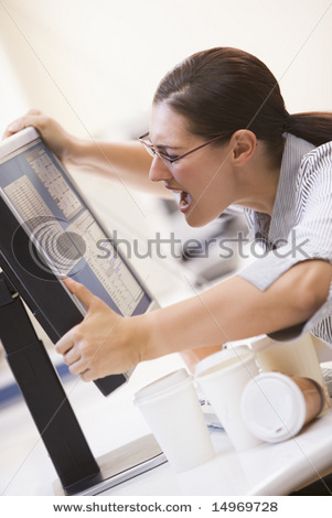 [stock-photo-woman-in-computer-room-grabbing-her-monitor-and-screaming-14969728.jpg]