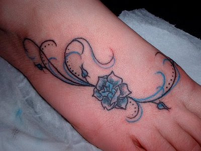 skull and rose tattoo. blue rose tattoos