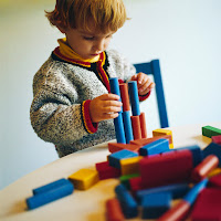 Little Boy playing with blocks