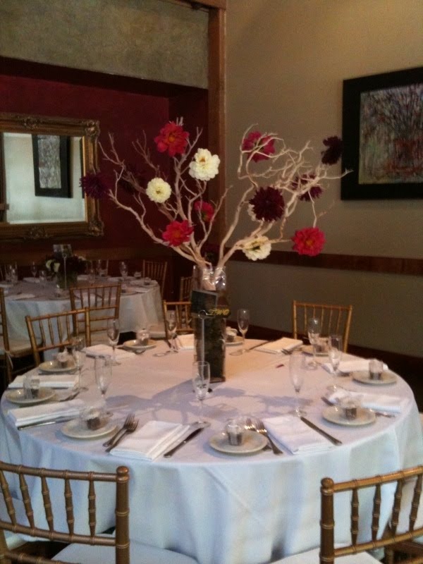 We used seasonal dahlias in white red and burgundy to create centerpieces 