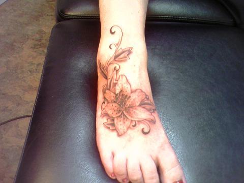 Sample Tattoos - Flower tattoo on foot