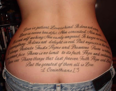 Lower back alphabet letters tattoo