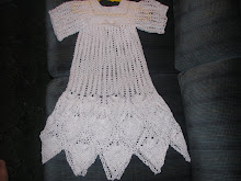 A BABY'S DRESS IN PINEAPPLES