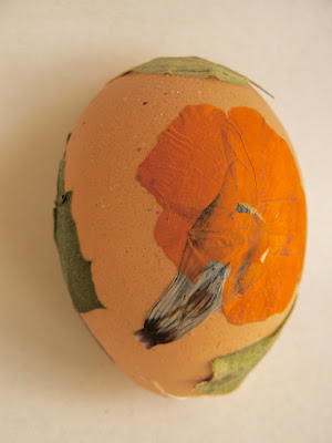 Easter egg decorated with pretty pressed flowers