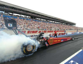 dragster with wheels smokin'