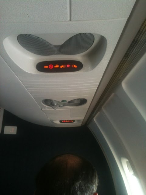 Yet, the seatbelt sign is on airplane seat belt sign. Yet, the seatbelt sign is on