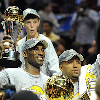2009 NBA Champion Los Angeles Lakers - Kobe Bryant Holding the NBA Finals MVP Trophy with Point Guard Derek Fisher