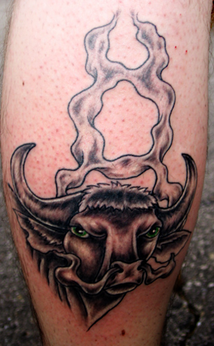 It black art taurus tattoos symbolizes attributes of ambition steadfastness
