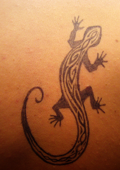Tribal gecko tattoo designs are very popular with their bold black patterns