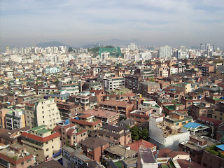 The view of crowded buildings from the Dormy highrise