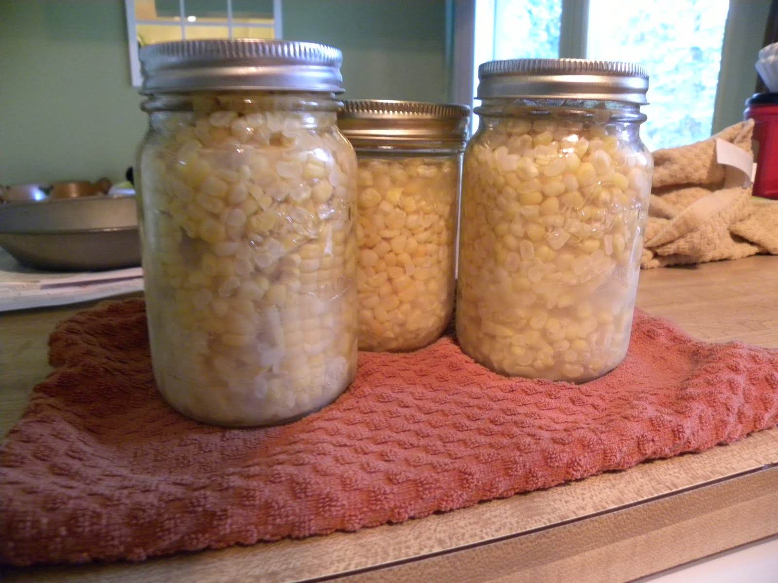 From The Hive canning corn and eating blooms