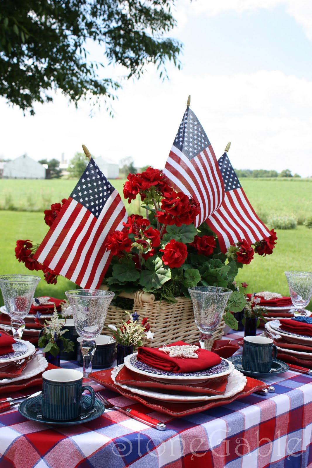 Each place setting is a mix of red, white and blue mismatched dishes.