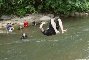 Splashing time: Picnickers having fun in this icy cool stream at the Kuala Woh recreational park.