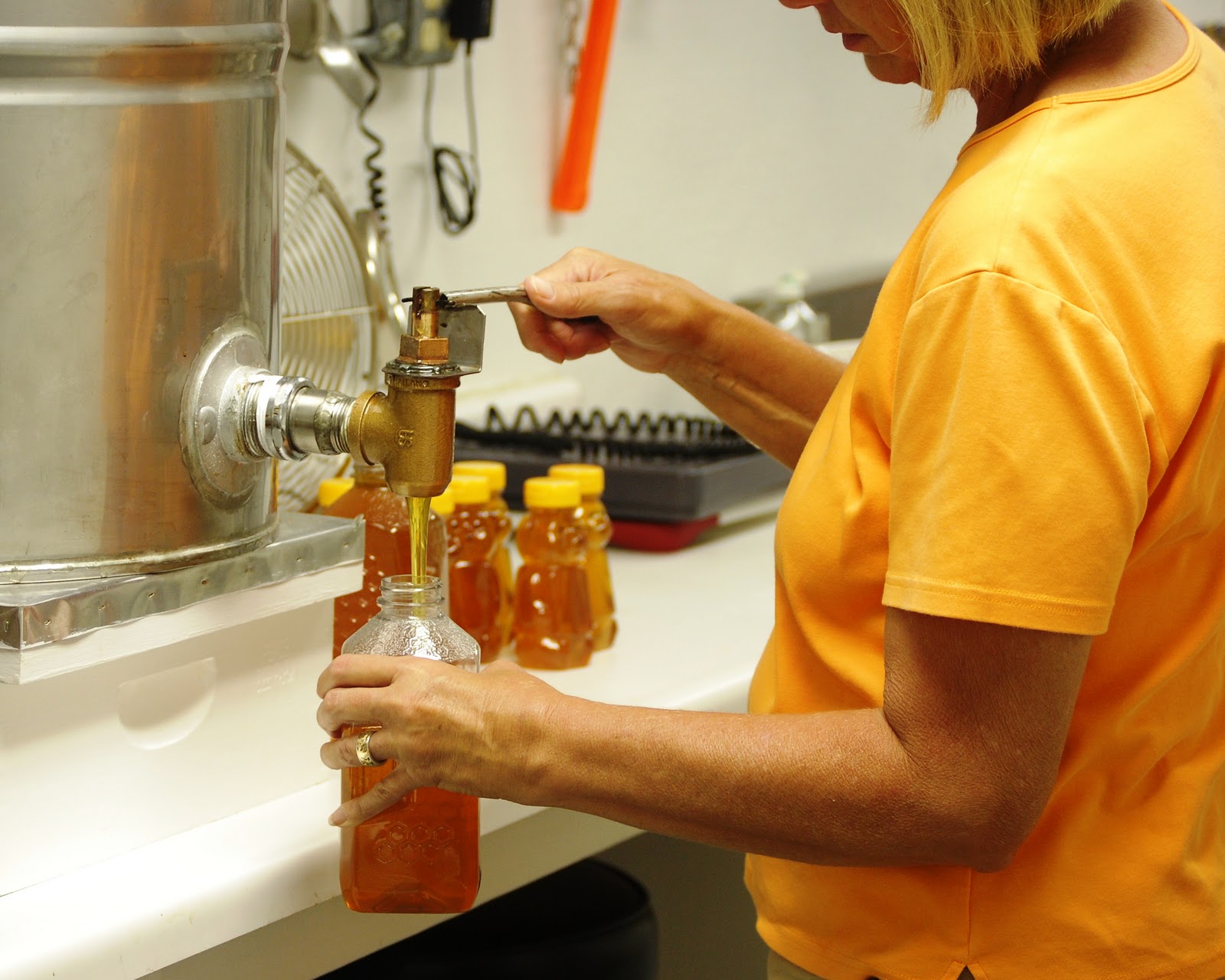 The Peace Bee Farmer Bottling Honey