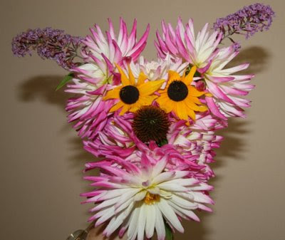 Cute puppy flower arrangement with dahlias