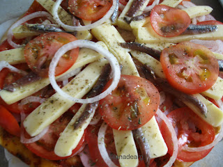 Pizza with anchovies and blue cheese.