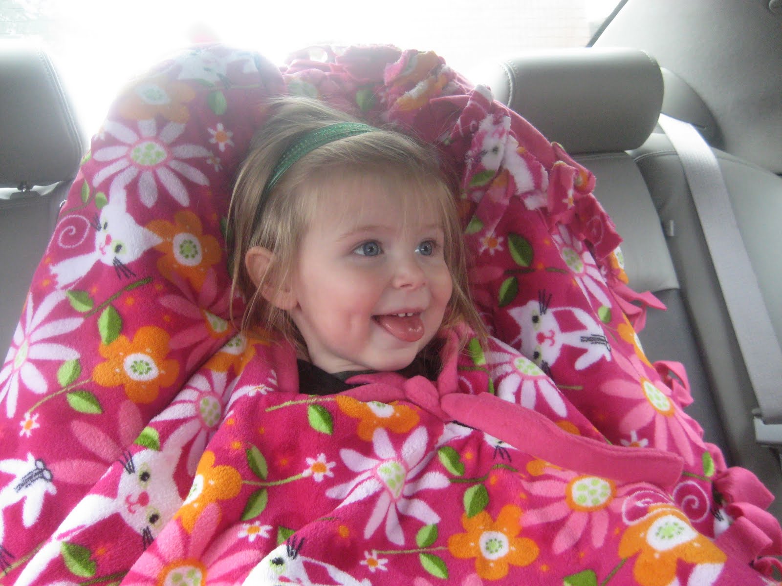 [[2009.10.31]+Wearing+her+poncho+in+the+carseat+1.JPG]