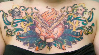sexy girl tattoo on top breast with complex design