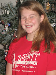 This is me in front of my friends christmas tree after spending the night at their house!!!!!