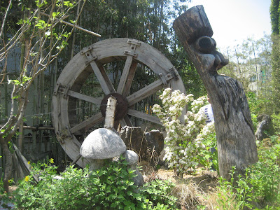 Wood carvings and a water wheel
