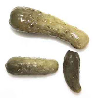 Three pickles. Photo of three pickles.