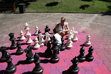 Mateo playing with a large chess set