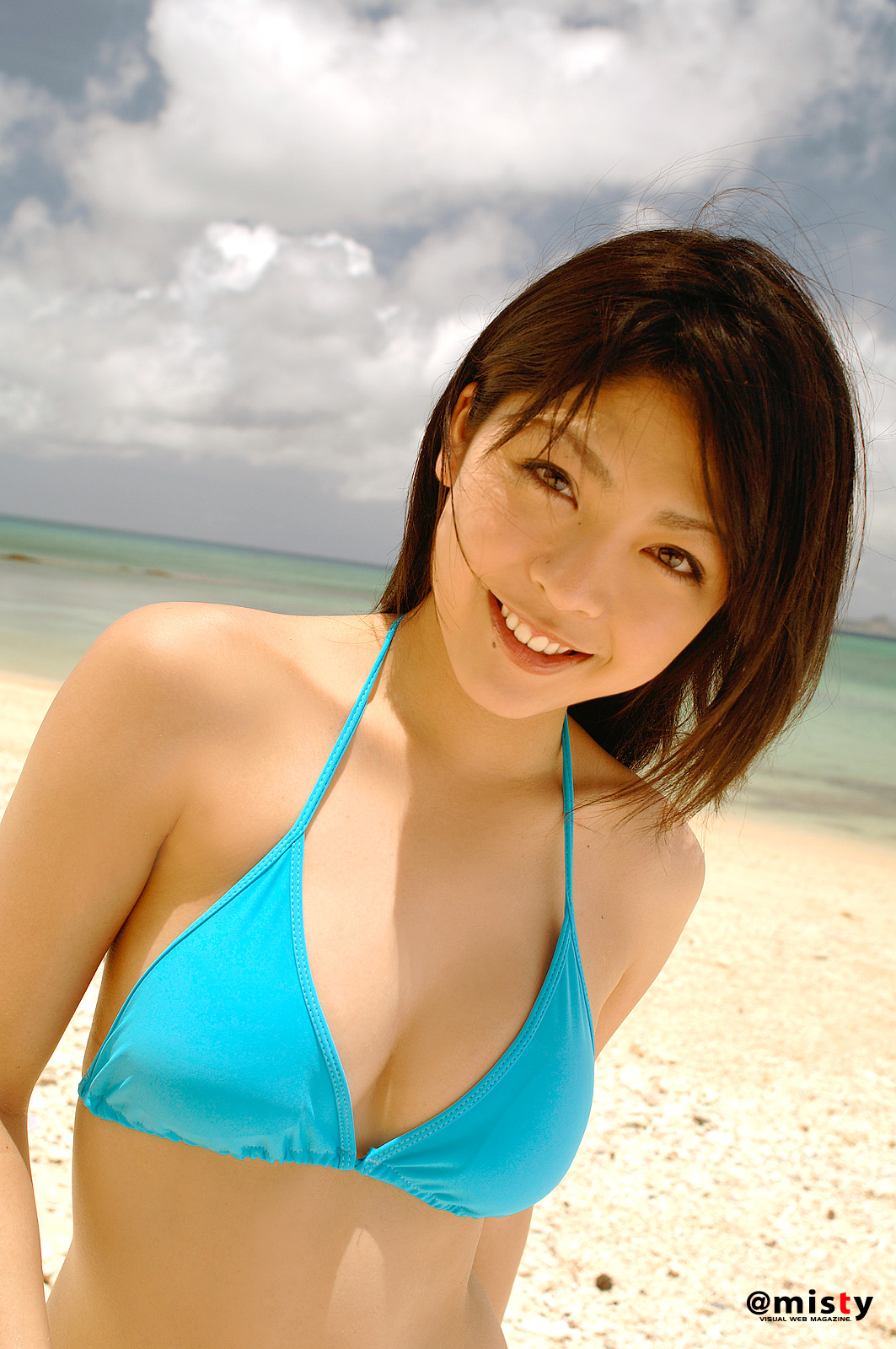 Sakura Sato blue bikini on the beach.