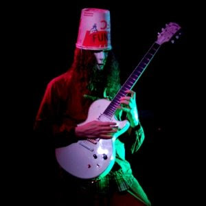 Buckethead is most known for his unconventional playing, avant-garde style, and overall weirdness. One of those odd things being the bucket on top of his head.