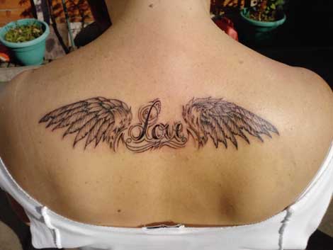 cross with wings tattoos. hot angels wings tattoos.