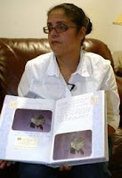 Vivienne Treharne, whose son, Christopher Lee, died in the womb in 1999, holds his infant book, which has cards that were placed on her door so nurses and visitors would know she had lost her child. Treharne is one of many who will be at a Walk to Remember on Tuesday at Lake Ella to help raise awareness of National Pregnancy and Infant Loss Awareness Day.