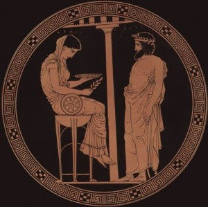 En una copa de finales del siglo V a. C., Egeo (un rey de Atenas) consulta a la diosa Temis, una predecesora mítica de Pitia. Egeo consulta el Oráculo acerca de su falta de descendencia. Poco después será padre del héroe Teseo.