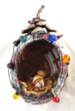 Ornament made with Autumn leaves and a pinecone