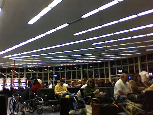 a group of people sitting in a waiting area