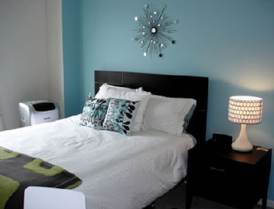  bedroom with the dark headboard and furniture and simple white linens