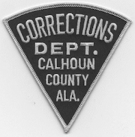 Source: Corrections Department Calhoun County Alabama via Google Sleeve patch reading Corrections Department Calhoun County Alabama