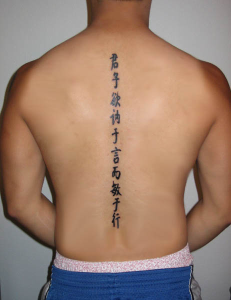 writing tattoos on back