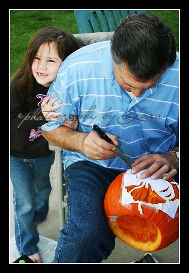 [IMG_8664+Grandpa+and+Chloe+carving+pumpkin+web.jpg]