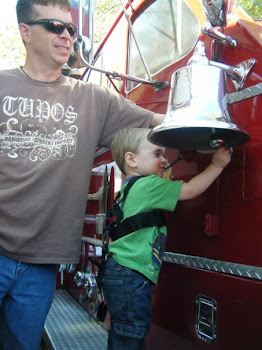 Dad and Caleb with a fire truck