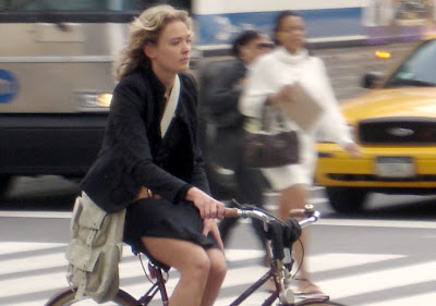 Image of stylish woman on bicycle