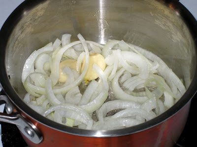 Brown sliced onions and whole garlic cloves